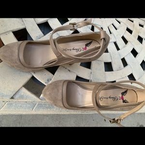 Beige women’s criss cross ankle heels